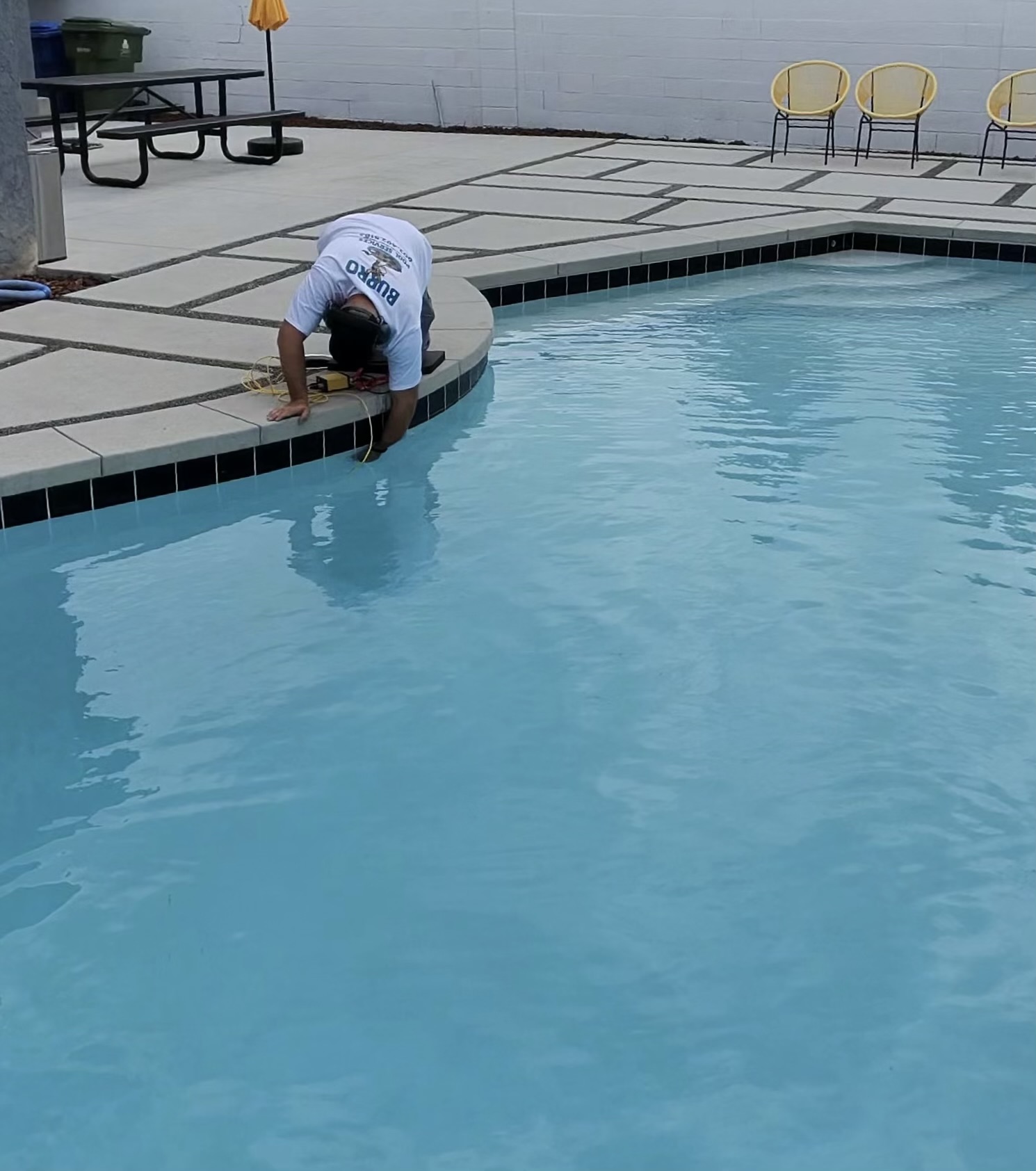 Burro Pools technician performing electronic pool leak detection on an Arizona backyard pool